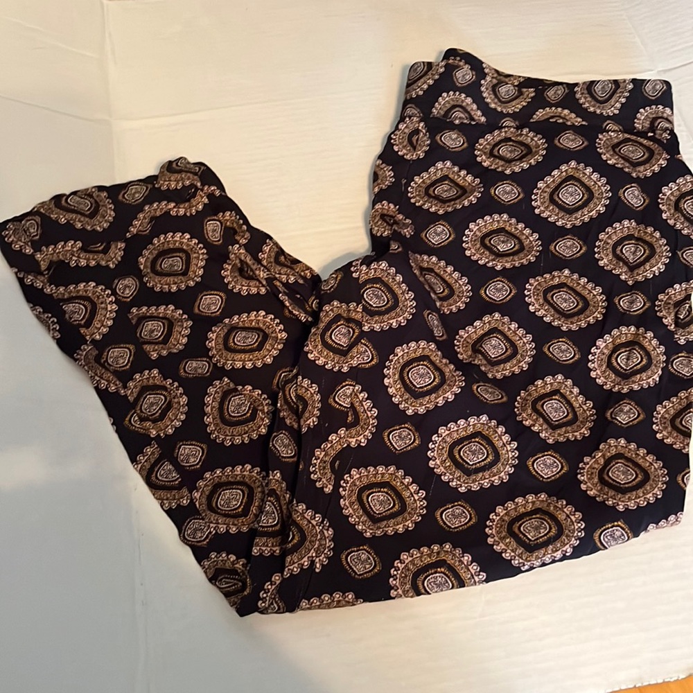 Ann Taylor loft size medium multicolored design on black pants. Like New